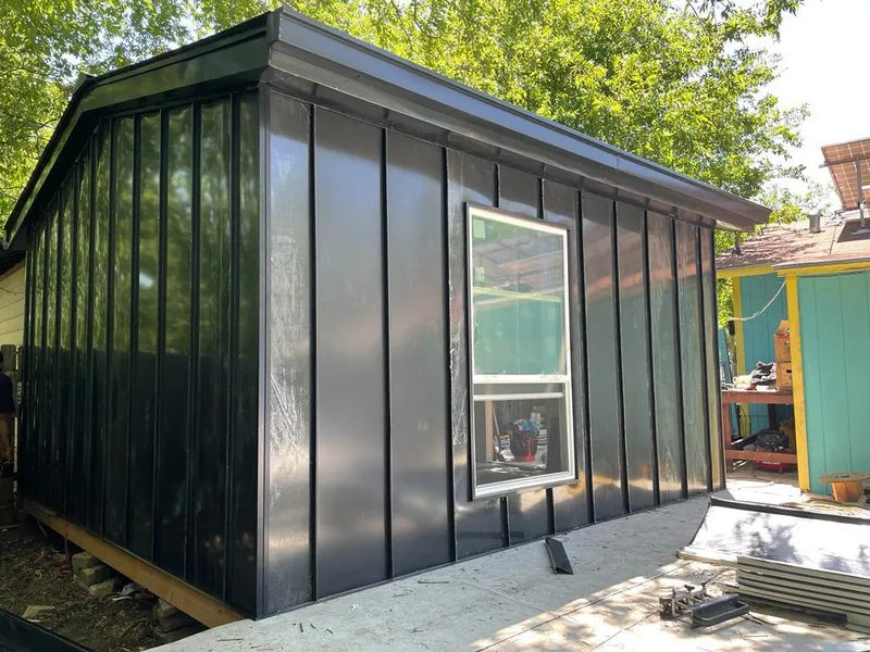 Black standing seam metal wall panels for Roof Inspection in Ken Caryl