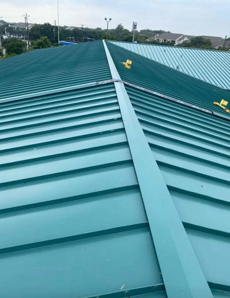 Green commercial metal roof ridge and valley for Metal Roof Repair in Ken Caryl